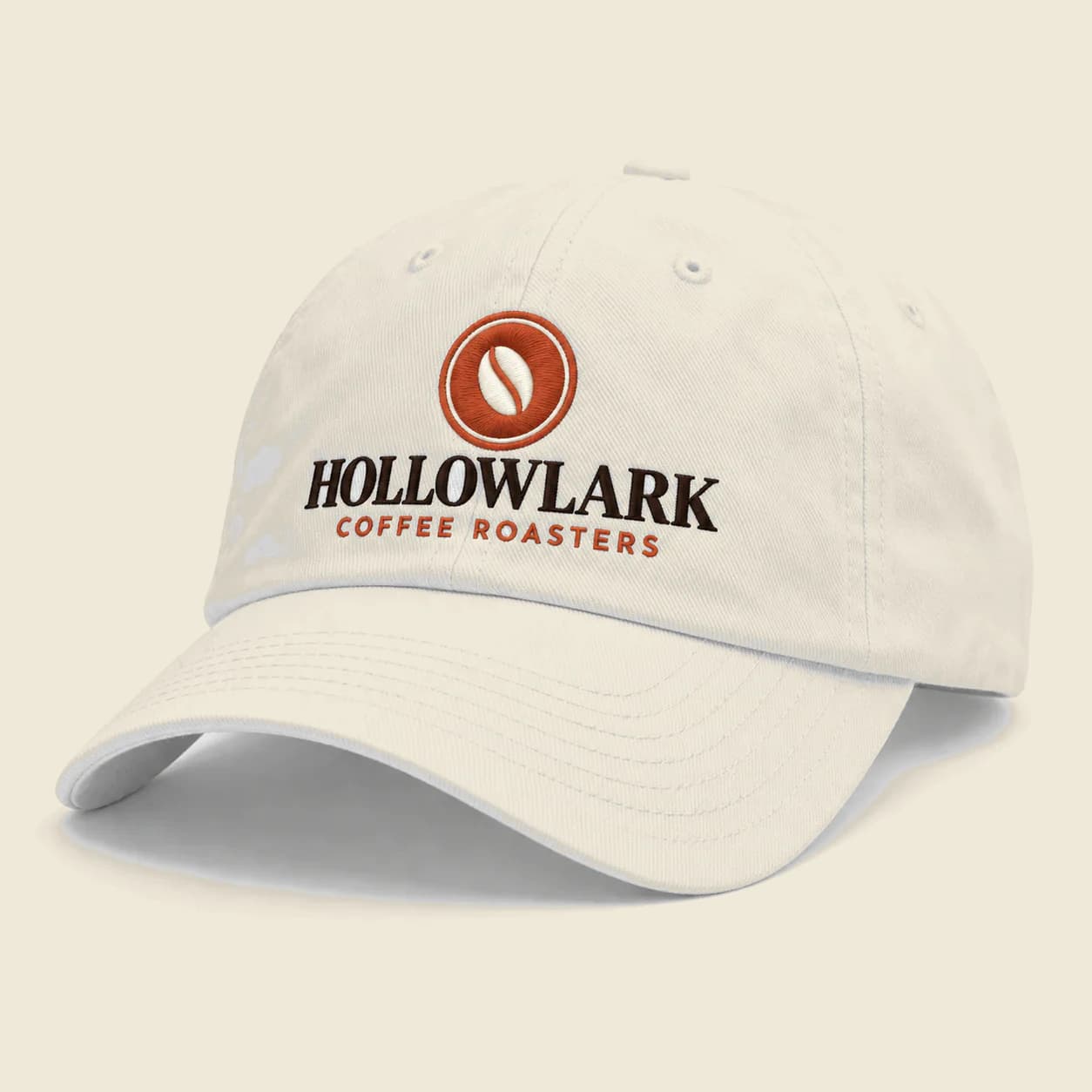 Custom Embroidered Dad Hats: White dad hat with an embroidered coffee roaster logo, sample artwork for a fictional brand