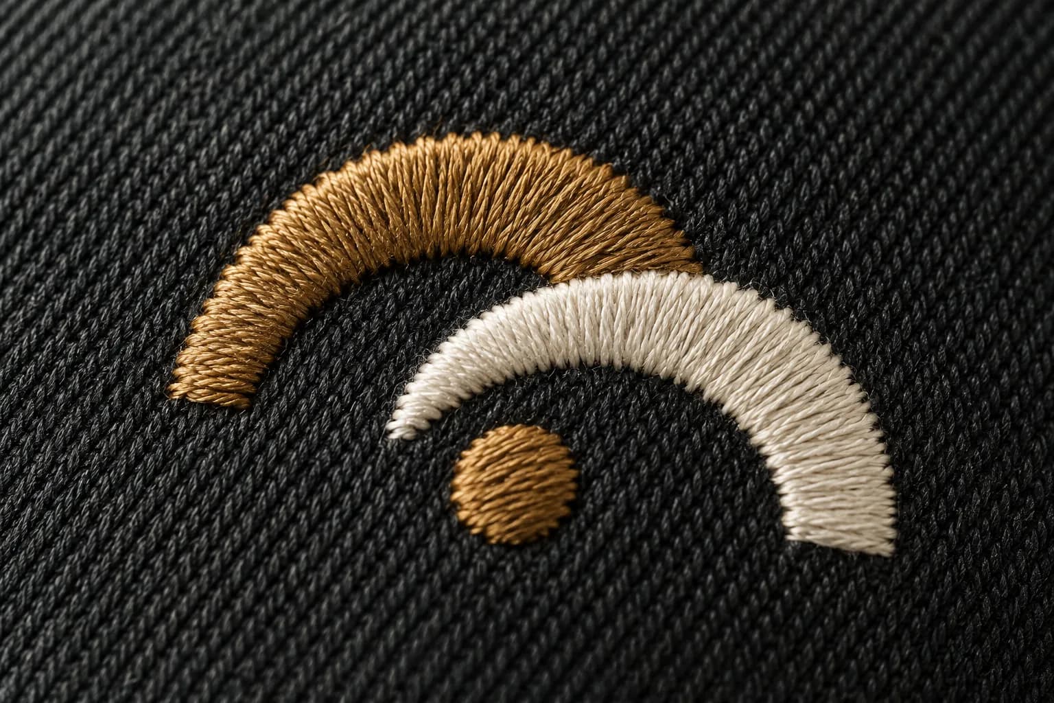 Close up of satin stitch embroidery on cotton twill