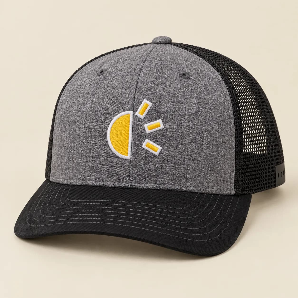 Custom Richardson Snapback Trucker Hats: Heather grey trucker hat with a black curved bill and mesh back, and a yellow and white sun sample logo