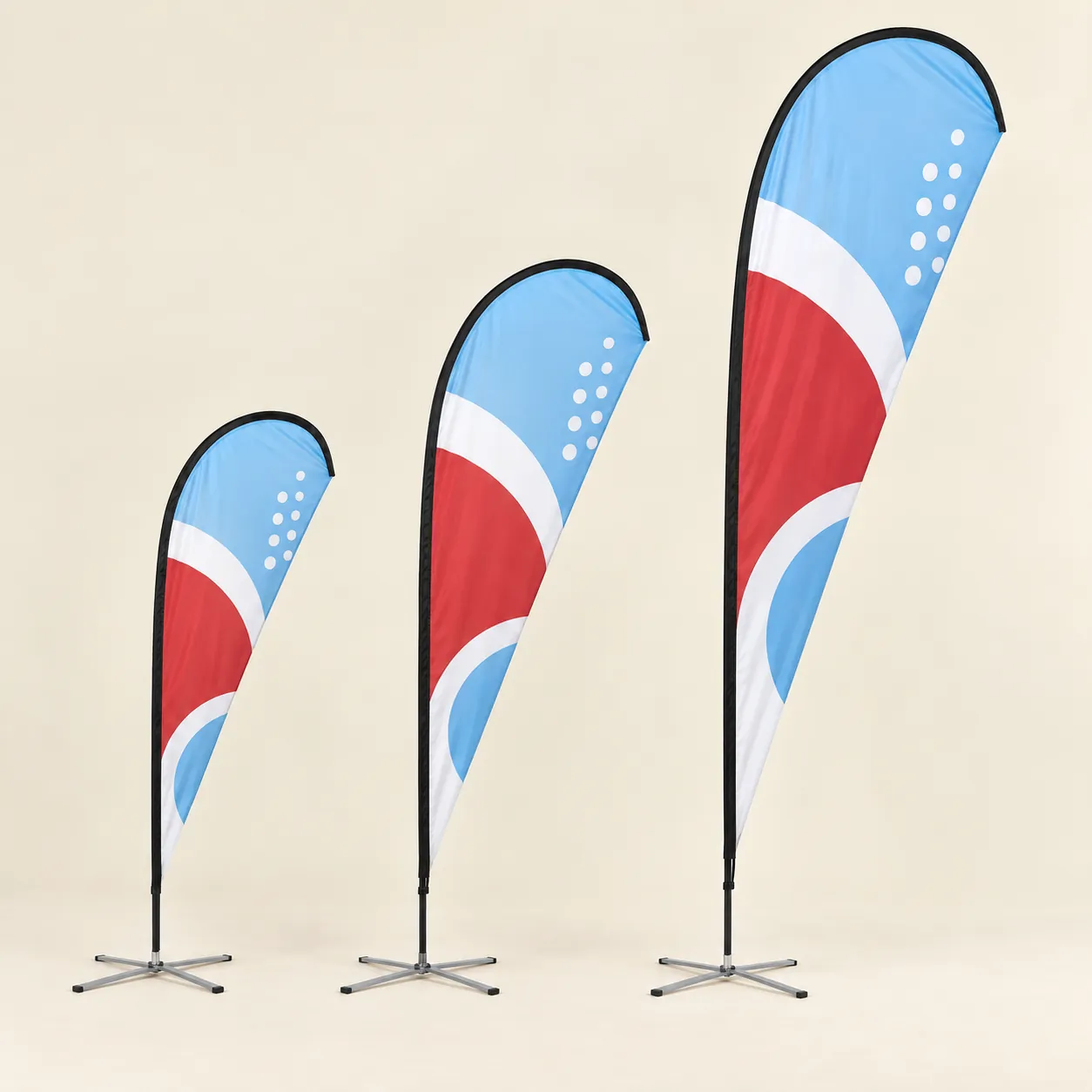 Teardrop Flags: 8 ft, 10 ft and 14 ft teardrop flags on X bases, printed with sample artwork