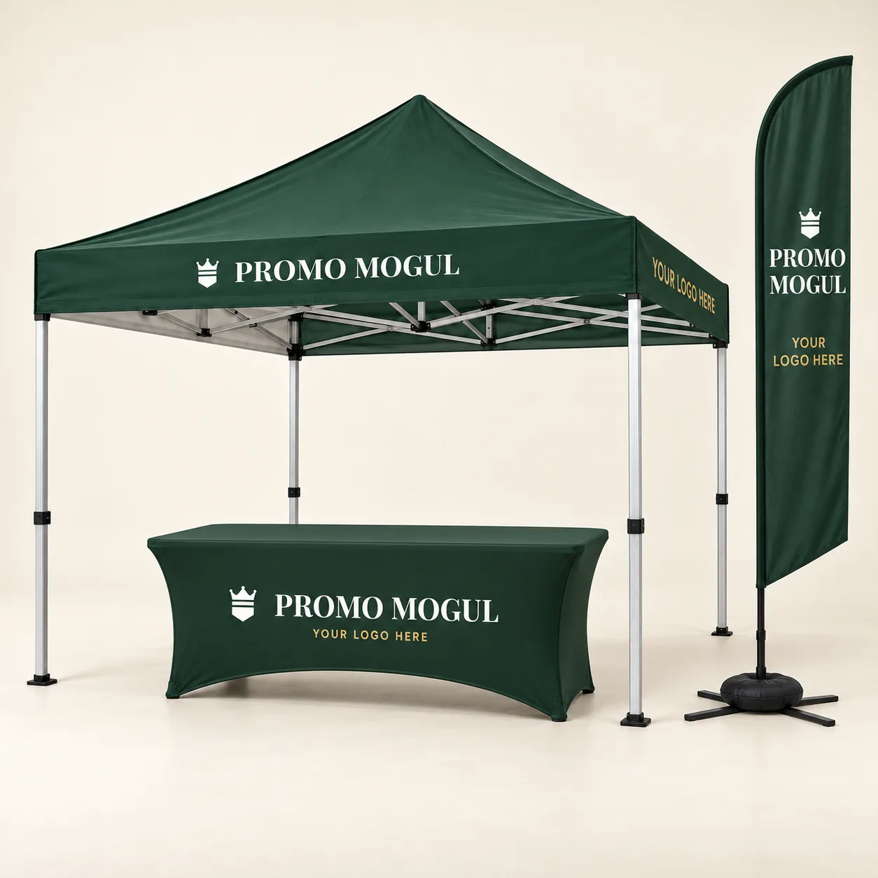 Booth Starter Kit printed with the PromoMogul logo, shown as a sample design: a 10 x 10 ft canopy tent with no walls, a 6 ft stretch table cover and an 11 ft blade flag on an X base with water bag